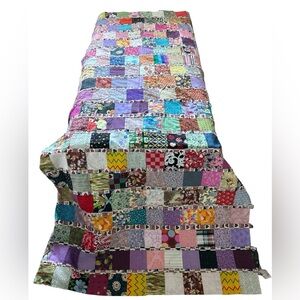 Multicolored patchwork quilt top